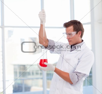 Scientist examinig a test-tube