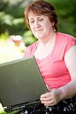 mid age woman with laptop