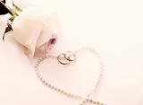 Rose, wedding rings, perl necklace