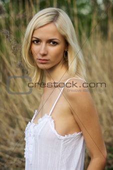 Portrait of a young woman in a countryside