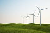 wind turbines on green grass field