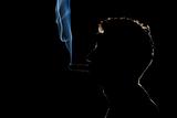 Silhouette of a Smoker in the night
