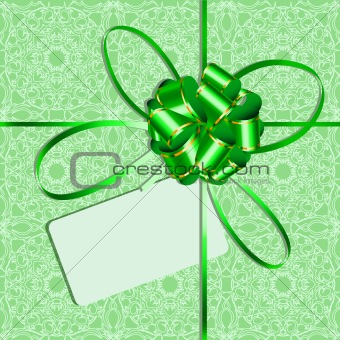 Celebratory packing with green bow and card