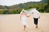 Couple Running On Beach