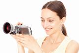 Young happy woman holding small video camera