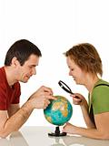 Couple looking at globe