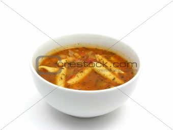 Noodle soup with tomatoes and herbs on white
