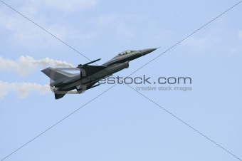 F16 in slow pass with smoke pods