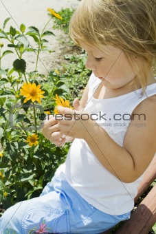 Girl holds flower