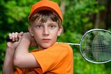 Cute boy with badminton racket