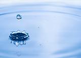 Beautiful splash of water and blue drop