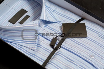 New man\'s shirt of blue colour in a gift box