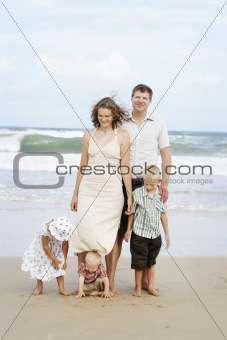 Family enjoying themselves at the beach.