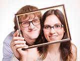 Happy pair in glasses in frame