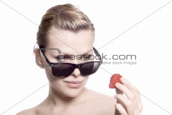 beautiful girl eating a strawberry