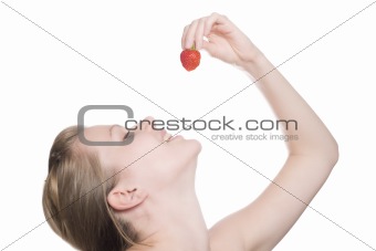 beautiful girl eating a strawberry