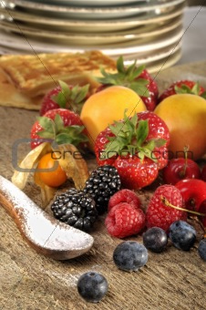 berries and fruits on a old table