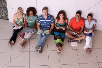 Group of happy students studying