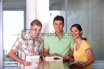 Group of happy students studying