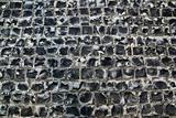 Old road made of stone bricks. Abstract texture background.