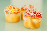 Brightly colored cupcakes.