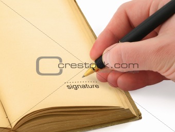 hand writing a signature