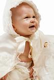 Baby in baptismal clothes