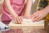 Woman and Child Kneading Dough