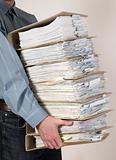 Man holding catalog of documents