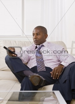 African American male watching TV