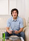 Cute guy playing video game