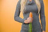Woman holding carrots