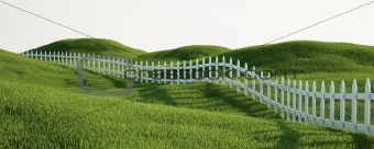 White picket fence on grass