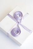 Gift in a white box with a lilac tape