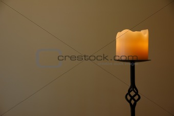 Romantic candle on a wrought iron stand