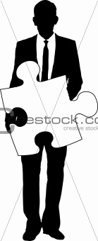 businessman holding jigsaw