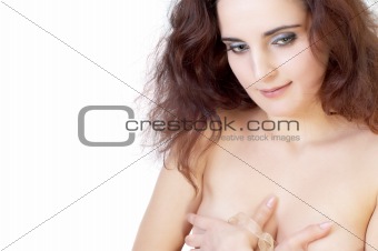 Beautiful topless girl hiding her breast. Isolated on white.