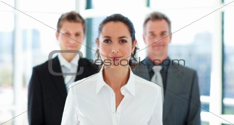 Beautiful businesswoman in front of her team