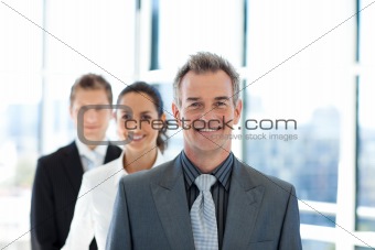 Smiling businessman leading a business team