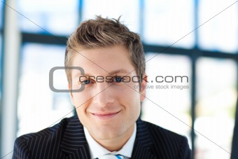 Young businessman smiling at the camera