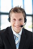 Smiling businessman with a headset on