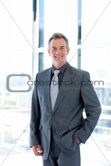 Smiling mature businessman in office
