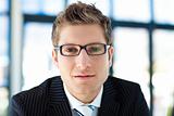 Businessman looking to the camera wearing glasses