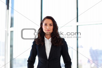 Attractive businesswoman standing in office