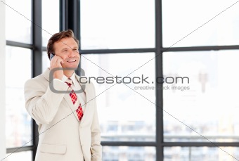 Businessman speaking on a mobile phone with copy-space