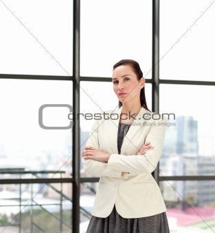Serious businesswoman standing in an office