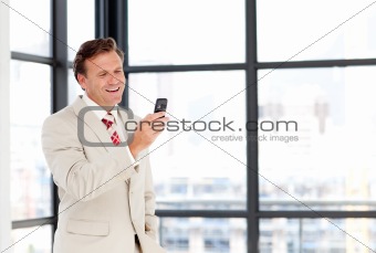 Mature businessman texting with copy-space