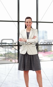 Beautiful smiling businesswoman with folded arms
