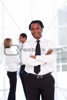 Confident African businessman smiling at the camera