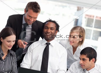 Multi-ethnic business team together in an office